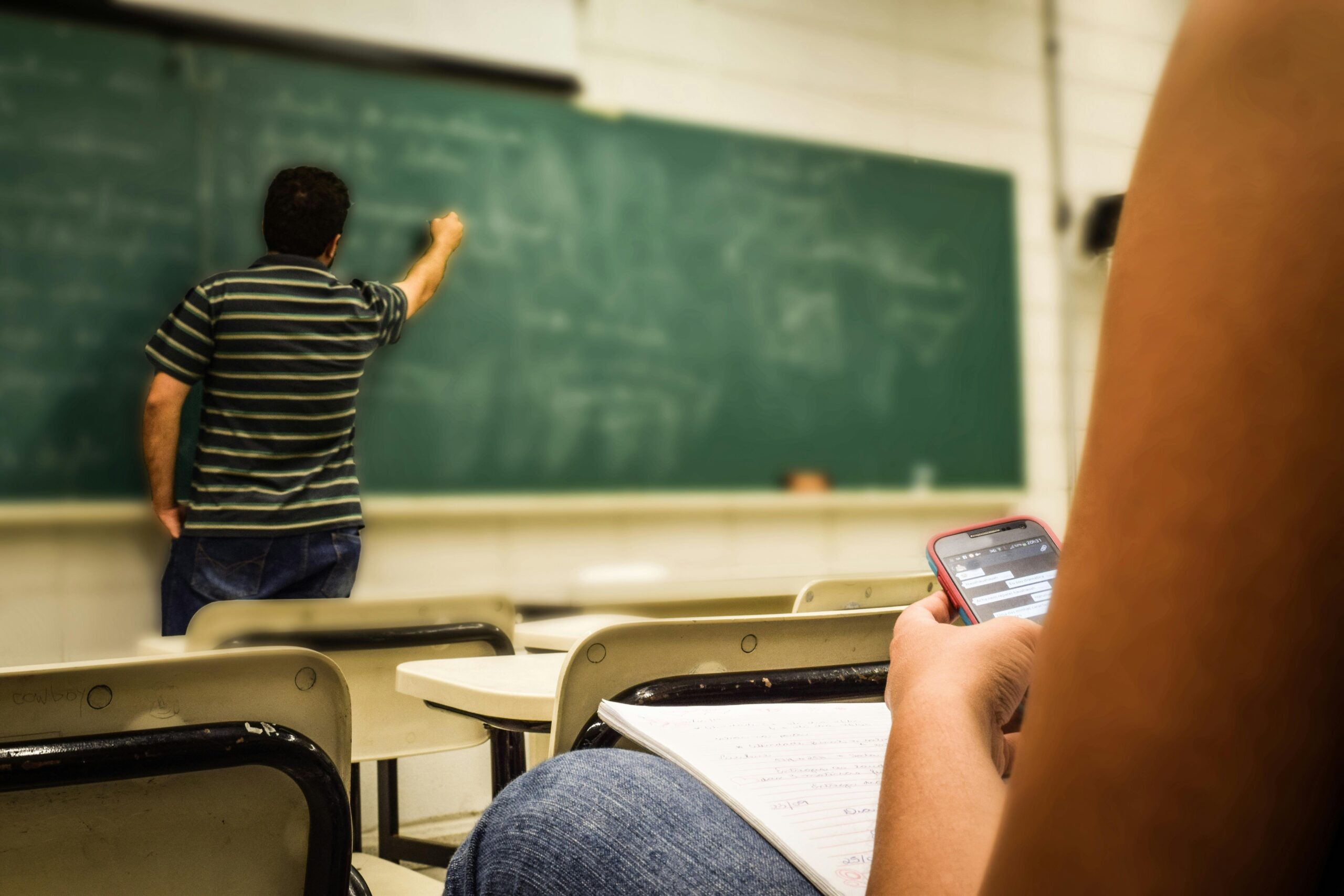 Person sat in a classroom learning